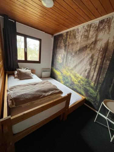 Postel nebo postele na pokoji v ubytování Le Chalet du temps suspendu
