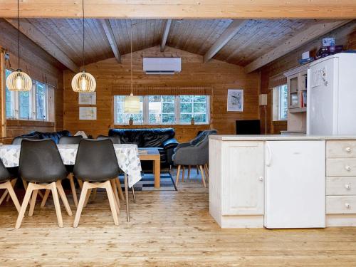 a kitchen and dining room with a table and chairs at 6 person holiday home in Fårvang-By Traum in Fårvang