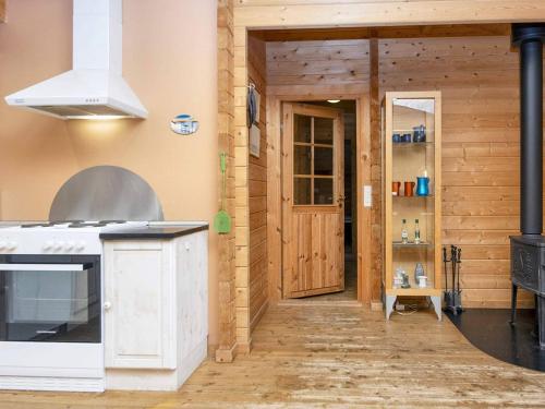 a kitchen with a stove top oven in a room at 6 person holiday home in Fårvang-By Traum in Fårvang