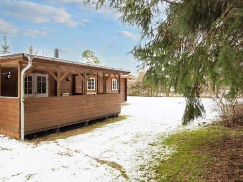 a small building with snow on the ground at 6 person holiday home in Fårvang-By Traum in Fårvang