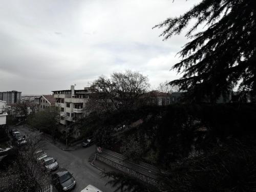 a view of a city with cars parked in a parking lot at OTTO X Hotel in Kavaklıdere