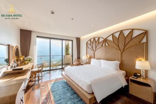Ένα ή περισσότερα κρεβάτια σε δωμάτιο στο KK Sapa Hotel
