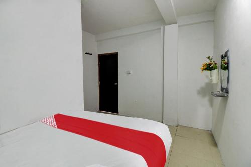 Ένα ή περισσότερα κρεβάτια σε δωμάτιο στο Hotel O Kings