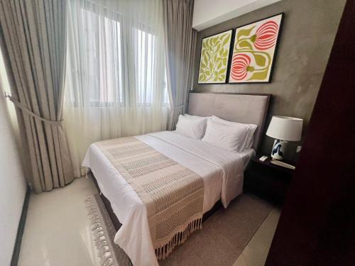 Postel nebo postele na pokoji v ubytování Colombo Skyline Luxury Apartments at Tri-Zen - Pool and Amazing City Views