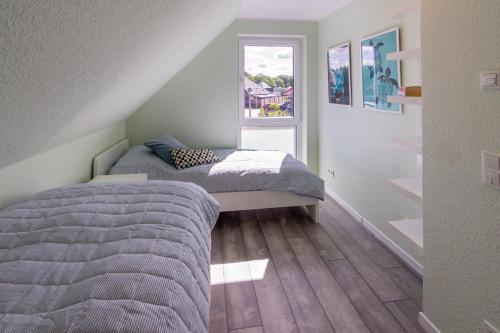 Postel nebo postele na pokoji v ubytování Seeperle