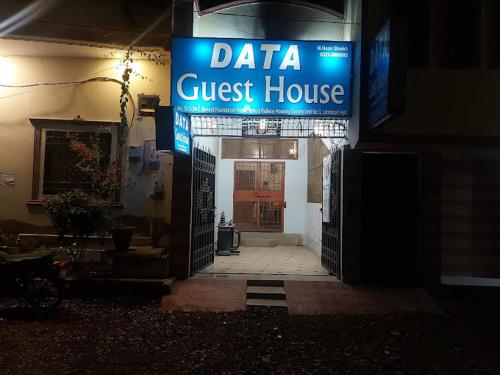 a guest house sign in front of a guest house at Data Guest House in Dargai