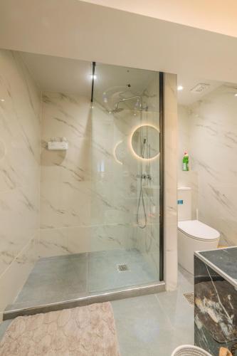 a bathroom with a shower and a toilet at Fairytale Apartment in Piraeus