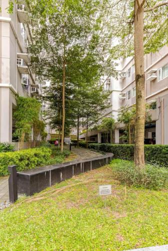 a park with a bench and trees in front of a building at 1BR Hotel Vibe Condo FULLY FURNISHED Trees Residences near SM Fairview in Manila