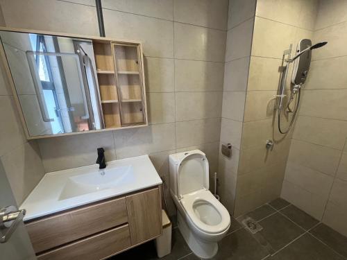 a bathroom with a toilet and a sink at Serenity Luna Suite at M Luna KL in Kuala Lumpur