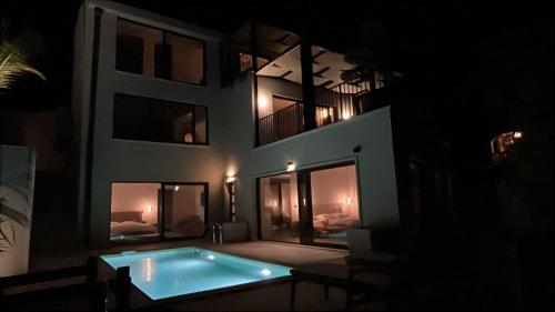 a swimming pool in the middle of a building at night at Vila panorama in Cetinje
