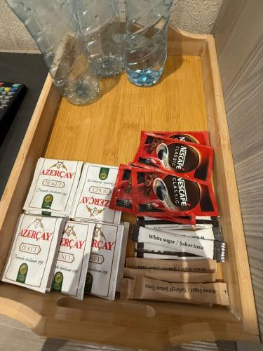 a wooden table with books on top of a table at Nizami Hostel in Baku