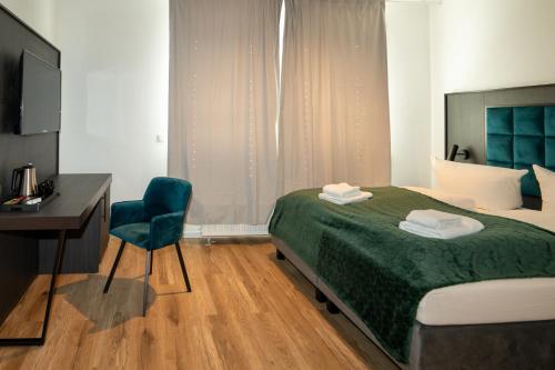 Ένα ή περισσότερα κρεβάτια σε δωμάτιο στο Hotel Hamburg Nord