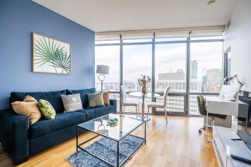 a living room with a couch and a table at 1BR High Floor View Downtown Toronto in Toronto
