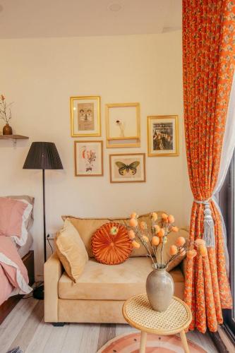 a living room with a couch and a table at Langmandi Experience Nhà Thờ in Hanoi