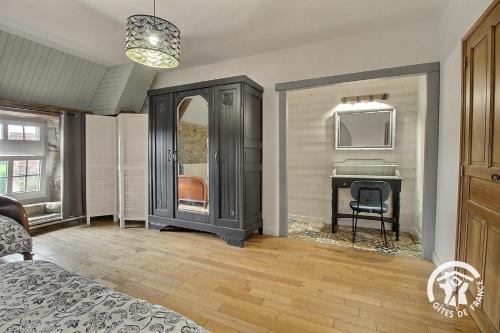 Ein Bett oder Betten in einem Zimmer der Unterkunft Manoir de kerloscant