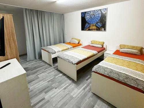 Postel nebo postele na pokoji v ubytování City View Apartment in Duisburg