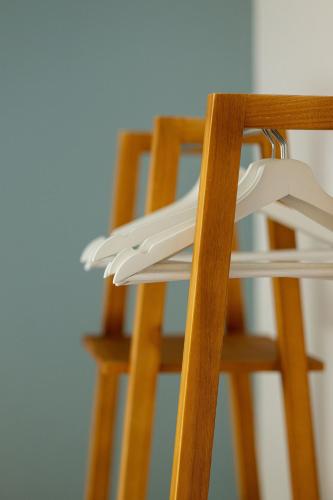 a pair of wooden chairs sitting next to a table at Vlierijck in Oost-Vlieland