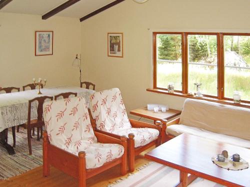 a living room with two chairs and a table at 6 person holiday home in Osby-By Traum in Osby