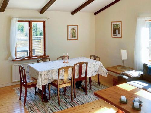 a dining room with a table and some chairs at 6 person holiday home in Osby-By Traum in Osby