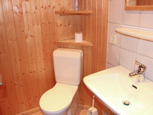 a bathroom with a toilet and a sink at Chalet in Sibratsgfäll near Ski Slopes in Sibratsgfäll