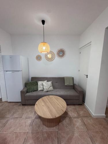 a living room with a couch and a table at Mar azul in Puerto de Mazarrón