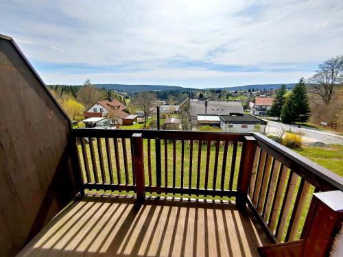 a balcony with a view of a town at FerienFleckl in Warmensteinach