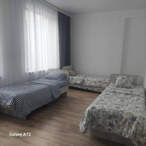 Ένα ή περισσότερα κρεβάτια σε δωμάτιο στο Guest House Alim