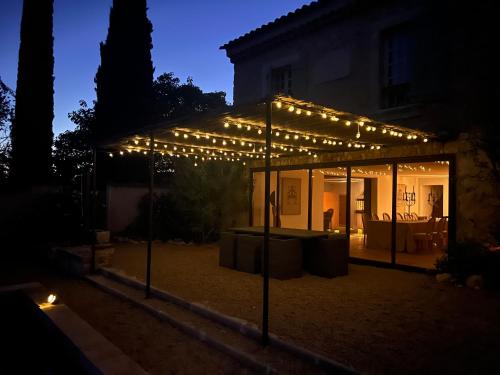 a lit up house with lights on it at night at Bastide du Luberon in Apt