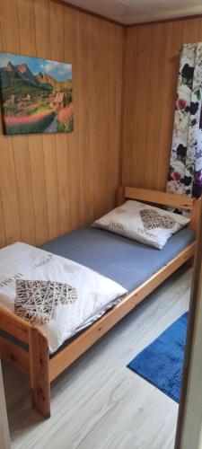 Postel nebo postele na pokoji v ubytování Pasiekówka domek nr 1