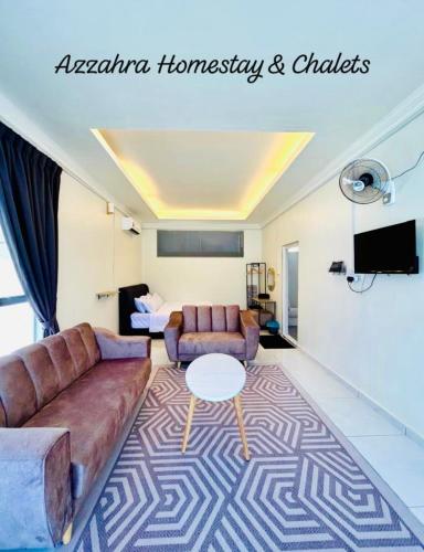 a living room with a couch and a table at Azzahra Homestay & Chalet in Temerloh
