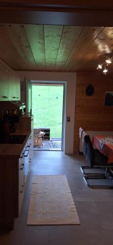 a kitchen with a large window in a room at Ferienwohnung Ingrid in Radmer an der Hasel
