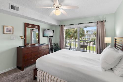 a bedroom with a large bed and a window at Maravilla 3202 in Destin
