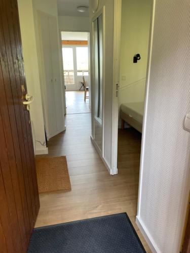 a hallway with a room with a door and a hallwayngthngthngthngthngth at Newly renovated flat on the slopes in Avoriaz