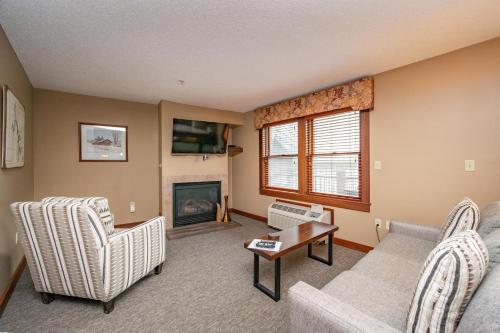 a living room with a couch and a fireplace at A204 Studio Standard View in Oakland