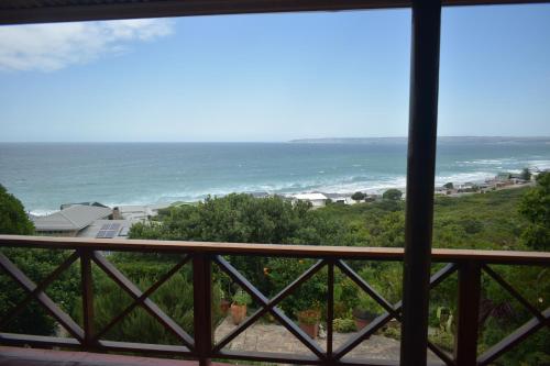 a view of the ocean from a balcony at At Whale-Phin Guest House in Reebok
