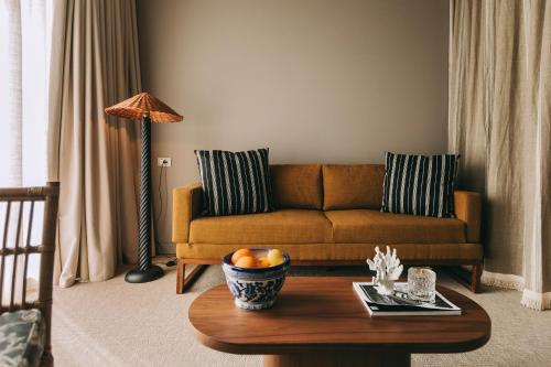 a living room with a couch and a table at Torel Terra Brava in Angra do Heroísmo