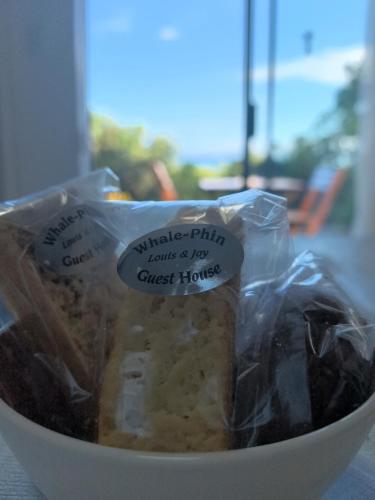 a bowl of food with a bag of food in it at At Whale-Phin Guest House in Reebok
