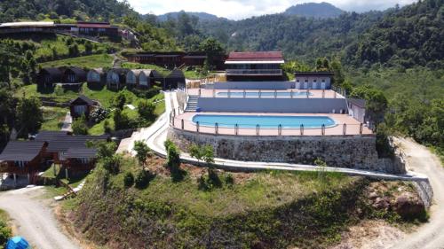 an aerial view of a resort with a swimming pool at Pandan View Mandeh in Pasarsungai-nyala