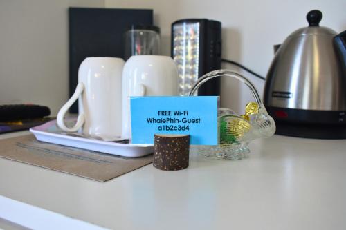 a kitchen counter with a tea wrath wrathostlabel on it at At Whale-Phin Guest House in Reebok