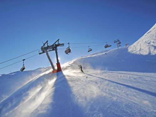 a person skiing down a snow covered ski lift at Apartment in Fügen near Ski Slopes in Uderns