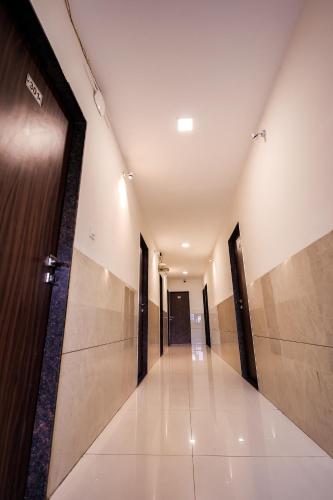 a hallway of a building with a door at Hotel Konark Nest-Vijay Nagar in Indore