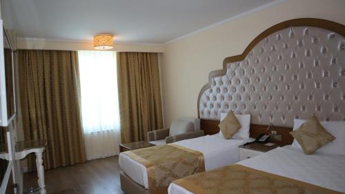 Letto o letti in una camera di Oz Hotels Side Premium