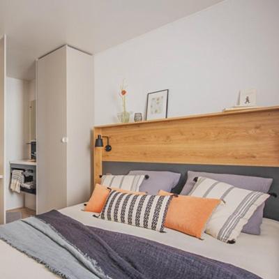 Llit o llits en una habitació de Camping Le Perpetuum