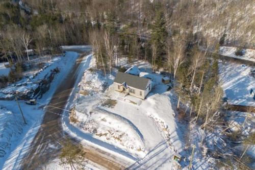 an aerial view of a house in the snow at Perchë Private SPA and Sauna Pool Table BBQ in Brownsburg