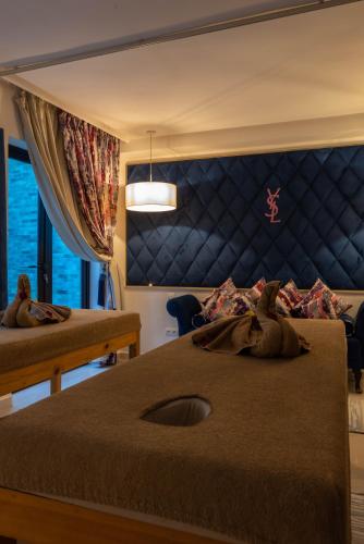 Postel nebo postele na pokoji v ubytování Eden Lodges & SPA-Boutique Hôtel de Luxe