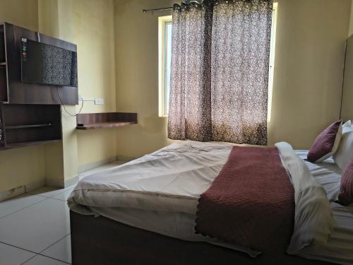 Katil atau katil-katil dalam bilik di Hotel shri Balaji