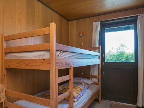 a bunk bed room with two bunk beds in a cabin at 6 person holiday home in Ebeltoft-By Traum in Ebeltoft