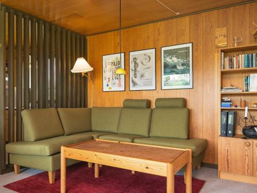 a living room with a couch and a coffee table at 6 person holiday home in Ebeltoft-By Traum in Ebeltoft