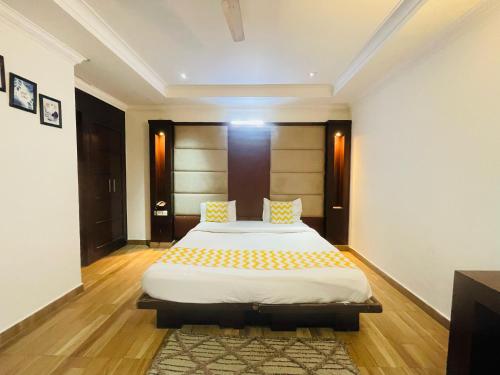 a bedroom with a large bed in a room at Hotel Imperial Inn - Nehru Place in New Delhi