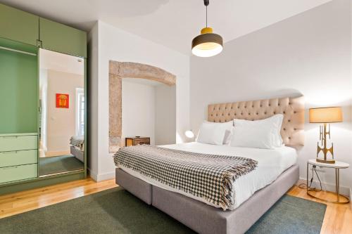Una cama o camas en una habitación de Monte Belvedere Hotel by Shiadu